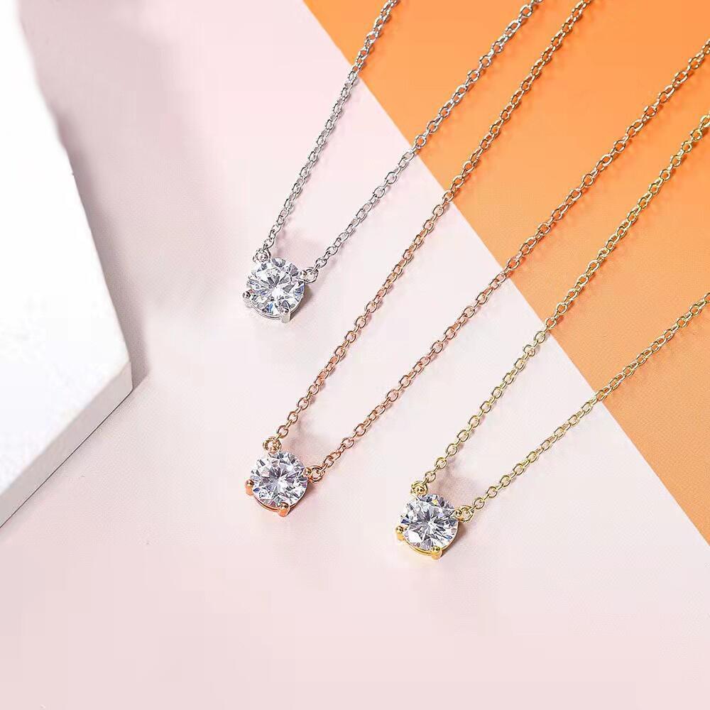 Three elegant solitaire necklaces displayed in silver, rose gold, and gold tones
