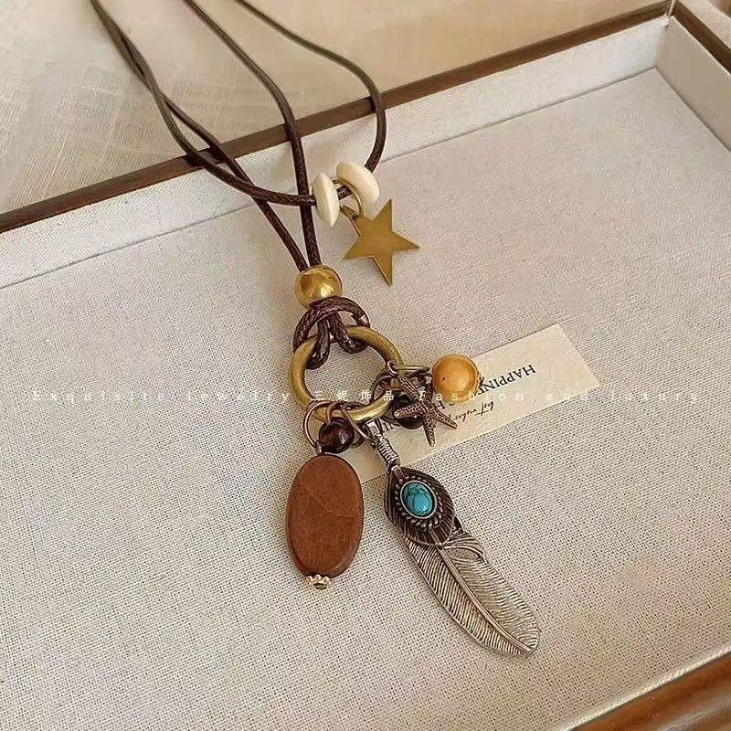 New Chinese Retro Long Sweater Chain Zen Feather Necklace for Women 2026 New Ethnic Style Stacked Accessories Autumn